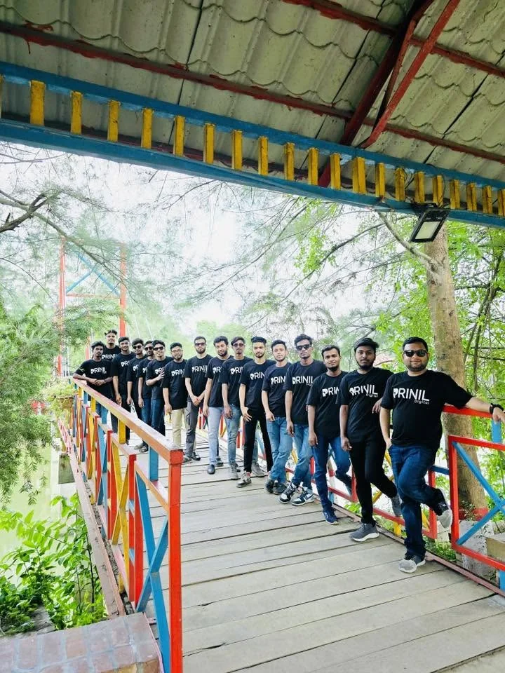 Members of the Prinil Digital team standing together during a team retreat.